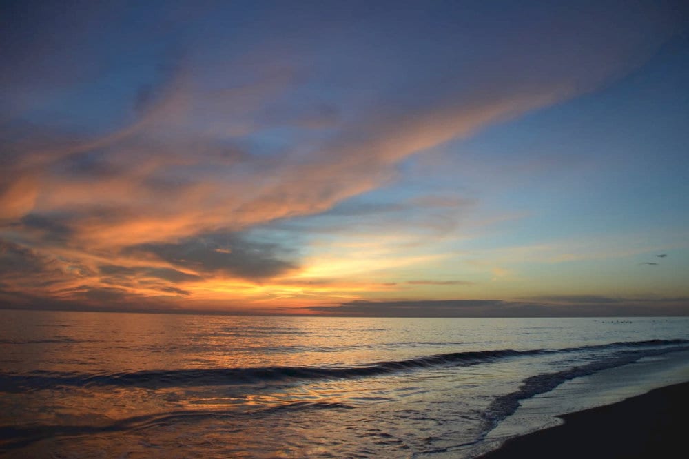 Arrive early to enjoy a serene sunrise or stay late to witness a stunning sunset over the horizon